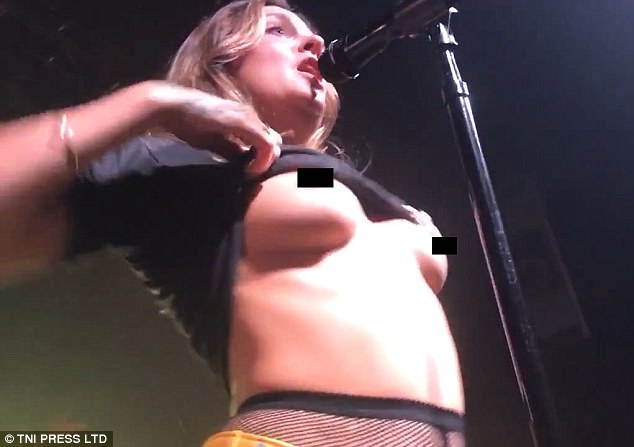 derek keenan add flashing boobs at concert photo